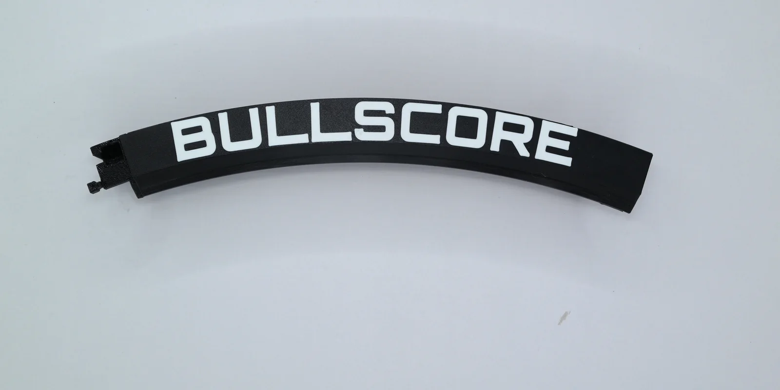 Ein Ringteil mit dem Schriftzug BULLSCORE und der Rastnase am Ende.